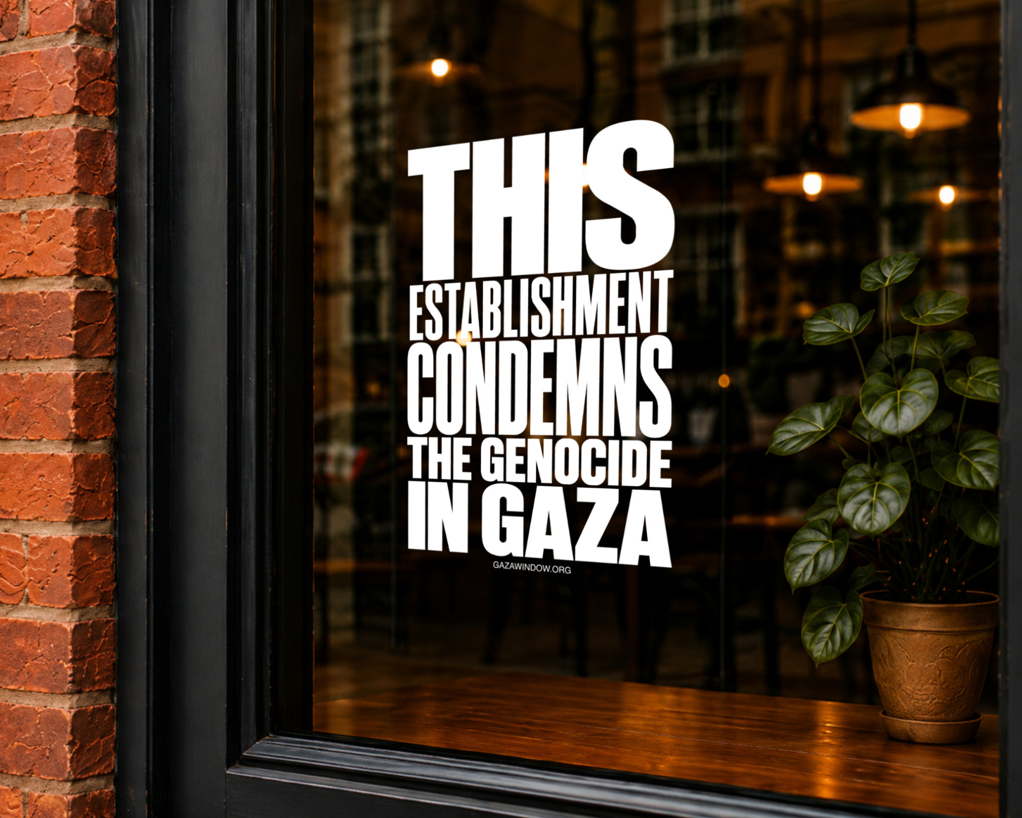 White Gaza Window sticker displayed on a café window